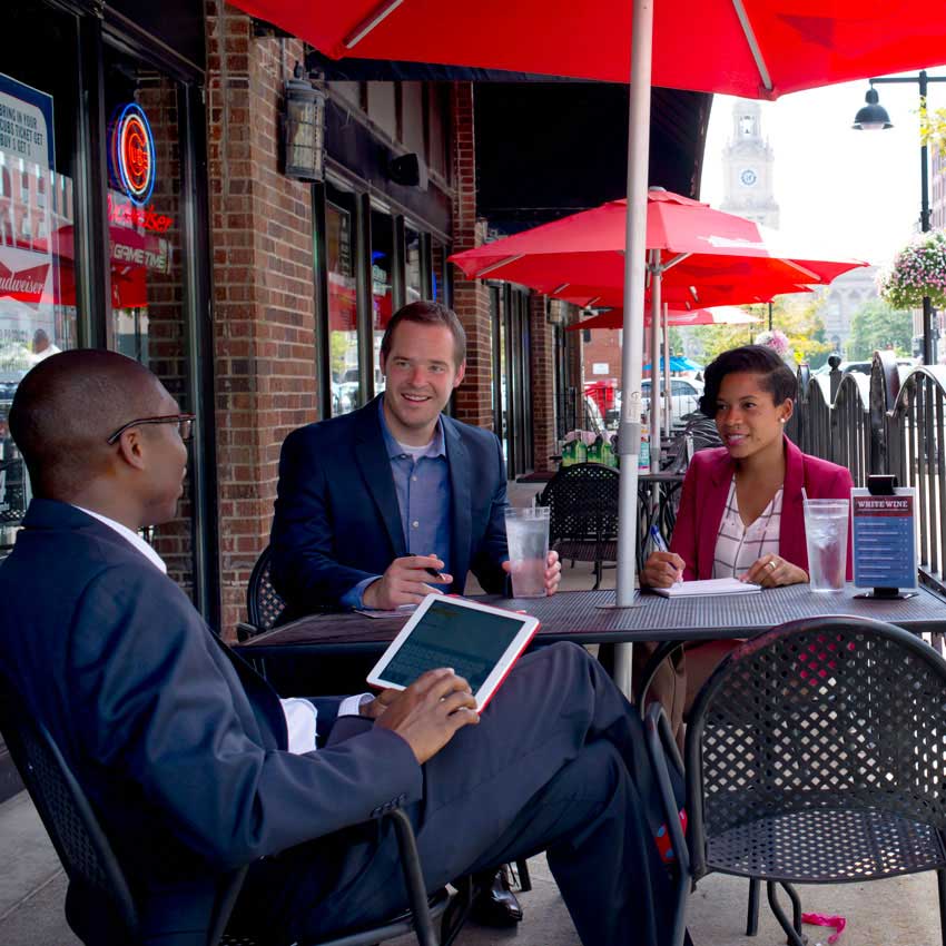 a group of three people at a table